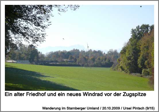 ein alter Friedhof und ein neues Windrad vor der Zugspitze