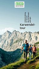 Bild zeigt die Broschüre "Karwendeltour "- Hüttentrekking im Herzen des Karwendelgebirges - zu sehen sind drei Wanderer auf einen Trekkingpfad im Karwendel