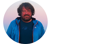 Bild zeigt ein Porträt von Markus Block, der Sektion München in einem Kreis. Er trägt einen Vollbart, etwas längere Haare und ist relativ braun gebrannt. Er trägt ein blaues T-Shirt und eine mittelblaue Outdoorjacke